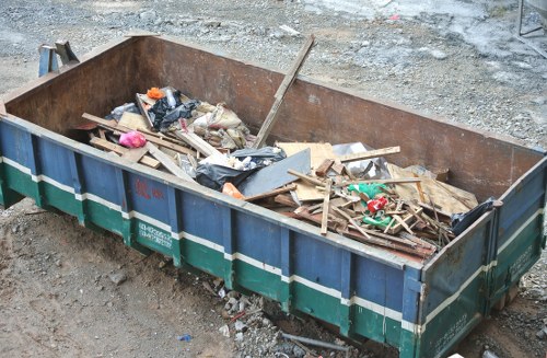 People disposing of old furniture in Redbridge